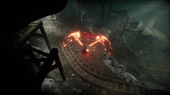 V Still getting up, a character stands in the center of the screen in a dark mine using axes to defend himself, glowing enlargements of the axes spread out in front of him.