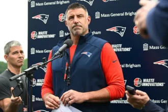 Mike Vrabel Emerges Wounded After Diving into Intense Patriots Practice.webp