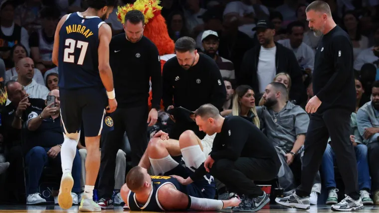 Nikola Jokic Exits Heat Match Following Suspected Knee Injury.webp
